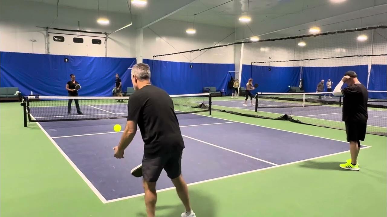 Doubles play across the E.H. indoor courts